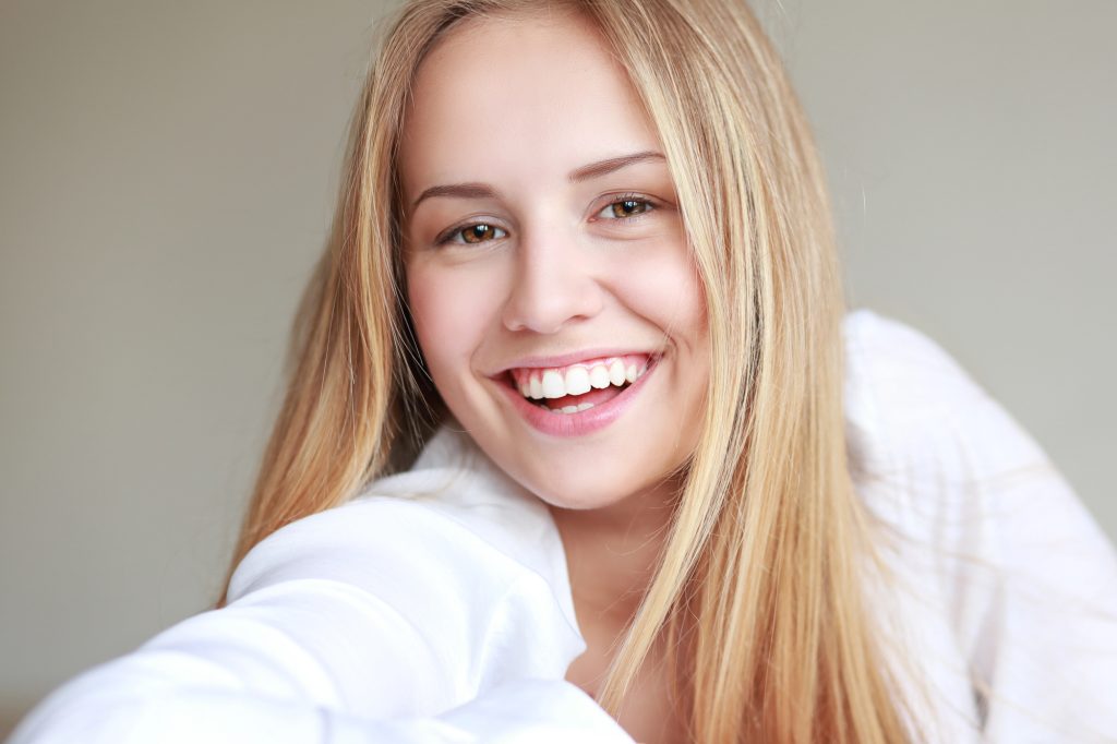 Teen girl with healthy teeth and gums. 